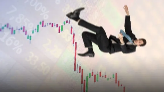Slippage illustrated: a businessman tumbling over against a plunging price chart